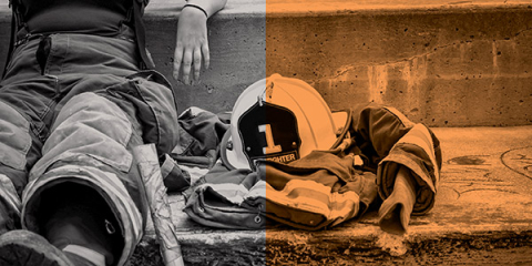 Female firefighter resting after a fire. 